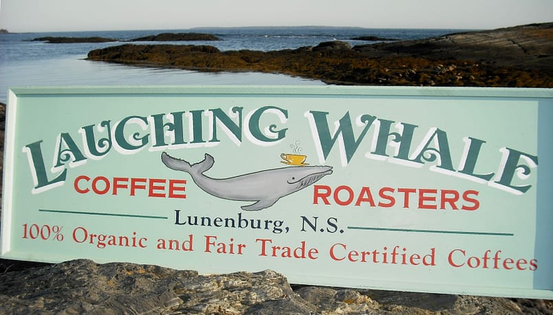 Laughing Whale Coffee Roasters Sign On Rocks